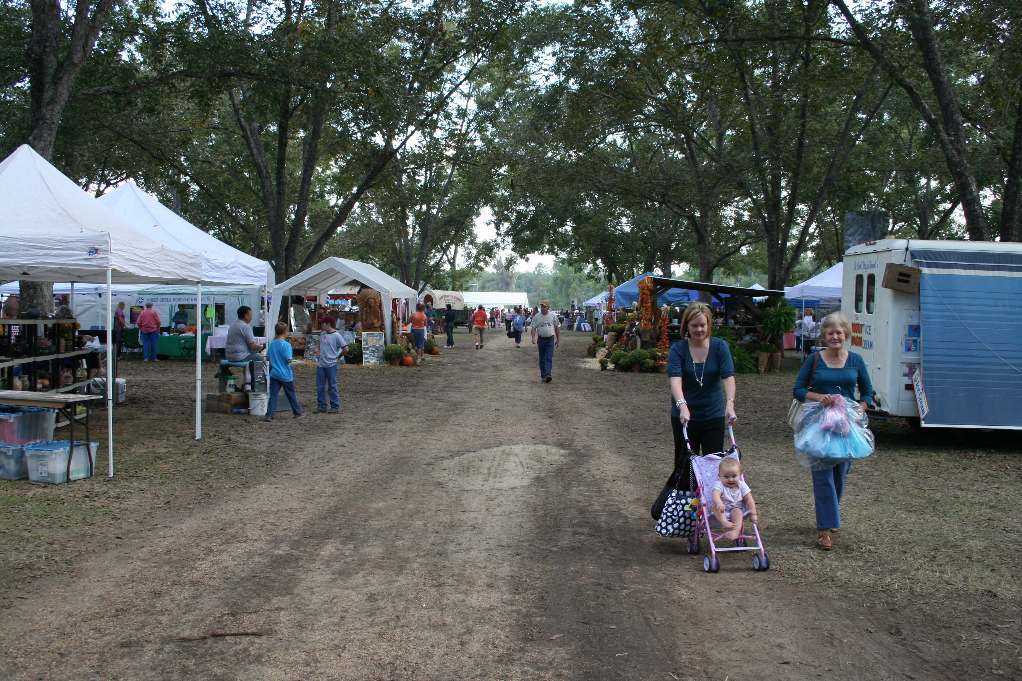 Families strolling the Pecan Festival grounds